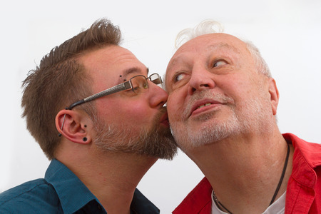 Happy homosexual Couple on bright background