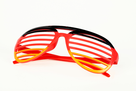 Fan glasses with the colours of the german flag isolated on white backgroundの写真素材
