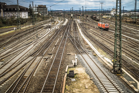 GIESSEN, GERMANY - APRIL 05, 2018: View of the railway station with a lot of Tracks and Train.のeditorial素材
