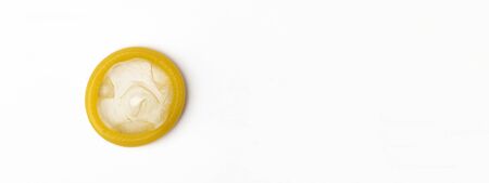 Unpacked Condom on a white Background. Concept with panoramaの写真素材