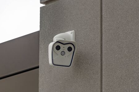 Electric camera on house facade in Detail