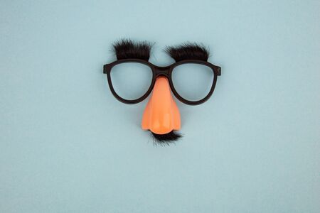 Funny Mask with Eyes and Nose on light blue Background