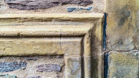 Weathered sandstone House facade in Detailの写真素材
