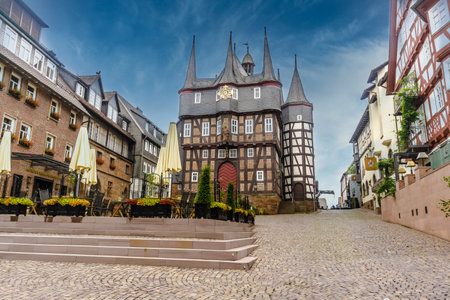 FRANKENBERG, GERMANY - July 15, 2019: Historical Town Hall in with terrace and seating of a hotel in...
