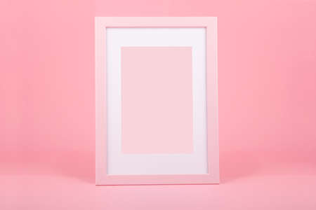 Decorative pink wooden picture frame over pink backgroundの写真素材