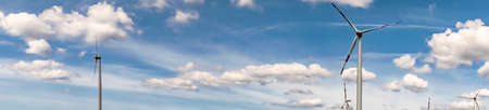 Panorma Windmill sourround blue clouds in summertime in germany