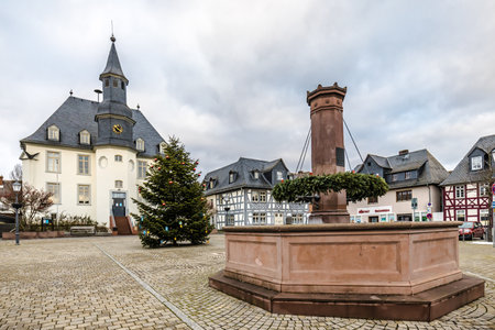 USINGEN, GERMANY- 09/01/2021: City hall and marketplace in Winter, Usingen, Germany