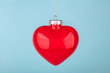 Decorative christmas heart over light blue backgroundの写真素材