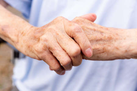 Femals hands in detail from old woman with bright backgroundの写真素材