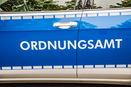 WETTENBERG, GERMANY - 2021-05-24: Lettering on a blue car from the german communal administration. Ordnungsamt is the name for an organizational unit within the local government in Germany.のeditorial素材