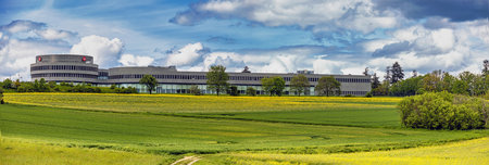 WETZLAR, GERMANY 2021-05-23: Panorama from LEICA Headquarter in WETZLAR, HESSE, GERMANY surround canola meadows, showing the contrast between modern optic industrial and beautiful nature.のeditorial素材