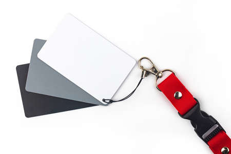 White, gray and black color balance card isolated over white backgroundの写真素材