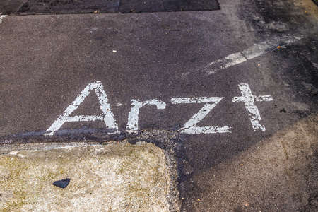 Parking lot marking for a medical doctor on old used asphalt areaの写真素材