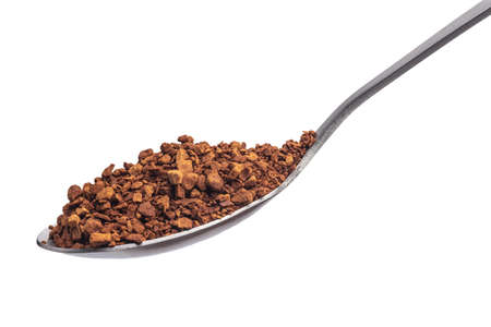 Powdered coffee on a teaspoon over white backgroundの写真素材