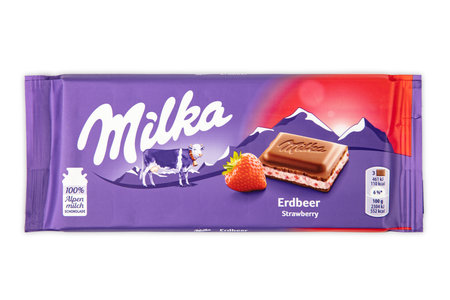 WETZLAR; GERMANY - 2022-04-11: Milka chocolate bar on white background. Milka milk chocolate bar. Milka is a brand of chocolate confection which originated in Switzerland in 1901.のeditorial素材