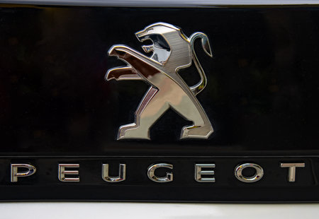 WETZLAR, GERMANY 2022-04-23: Peugeot logo closeup on a car grill. Peugeot as car manufacturer was...