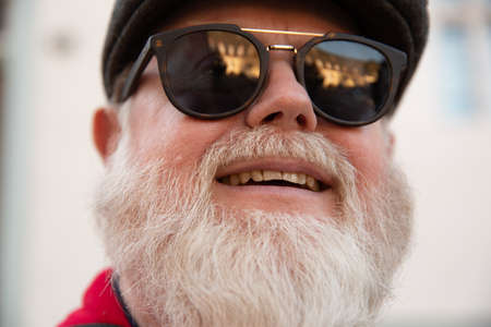 Headshot from friendly male man with big white beardの写真素材