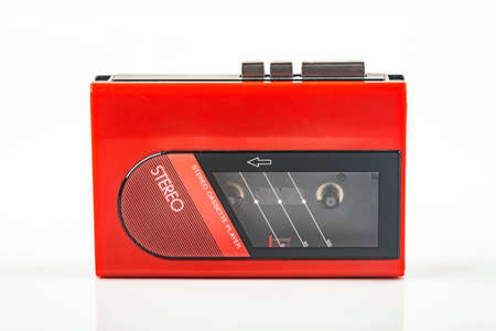 Beautiful red vintage audio cassette player over white backgroundの写真素材