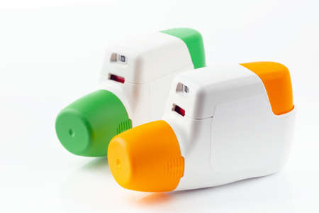 Two Metered Dose Inhaler isolated over white background