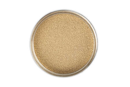 Dry yeast in a bowl over bright backgroundの写真素材