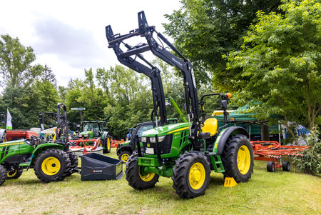 GERMANY - WETZLAR JULY 08: JOHN DEERE Tractor with hydraulic grab. John Deere is an American...