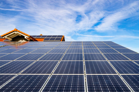 Photovoltaic panels on the roof . Roof Of Solar Panels. View of solar panels (solar cell) in the roof house with sunlightの写真素材
