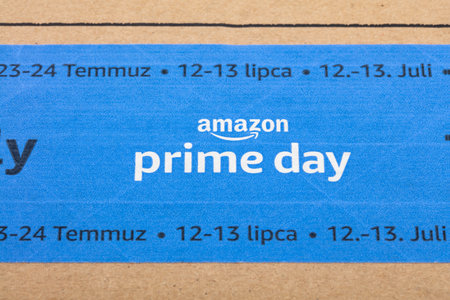 WETZLAR, GERMANY - 2022-07-16: Amazon Prime logotype printed on cardboard box security scotch tape. Amazon Prime is a service from Amazon which delivers parcels in 1 day.のeditorial素材