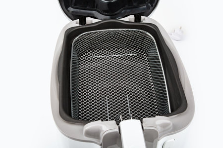 Basket from Air Fryer isolated on white backgroundの写真素材
