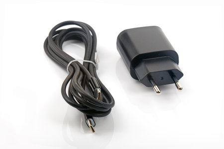 Power adapter with USB C cable isolated over bright backgroundの写真素材