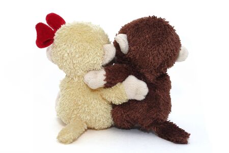 Pair of Stuffed Monkeys with arms around each otherの写真素材