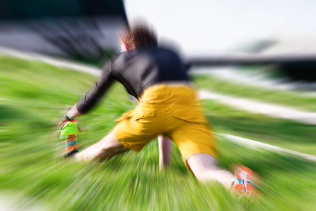 Warm up for the marathon. Man stretching his muscles at a meadow.の写真素材
