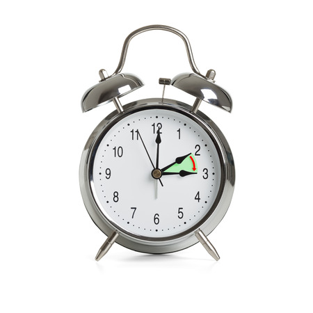 Clock time changing to summer time isolated on white background.の写真素材