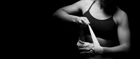 Woman preparing her hands for the fight.の写真素材