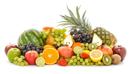 A heap of many different tropical fruits isolated on white background. Healthy food and nutrition, vegan lifestyle and organic fair trade concept.