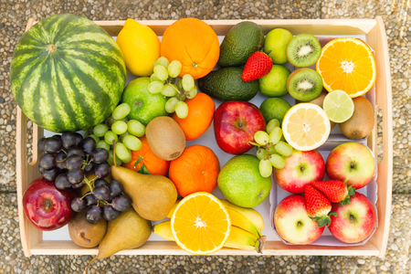 A heap of many different tropical fruits. Healthy food and nutrition, vegan lifestyle and organic fair trade concept.の写真素材
