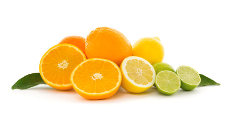 A heap of different tropical citrus fruits isolated on white background. Healthy food and nutrition, vegan lifestyle and organic fair trade concept.の写真素材