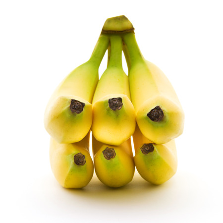 Perfect bananas with yellow and green color isolated on white background. Sports food and nutrition, healthcare and organic fair trade concept.の写真素材