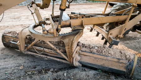 Motor grader working on road construction adjust level soil improvment