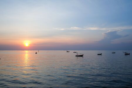 Sunset over the sea with jetty at Bangsaen Thailandの写真素材
