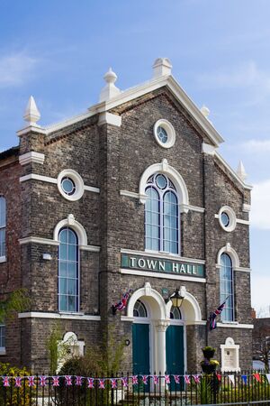 SELBY, UK - APRIL 21, 2016. The Town Hall building in the Yorkshire, market town of Selby decorated with the Union Jack Flag to commemorate the 90th birthday of Queen Elizabeth II.のeditorial素材
