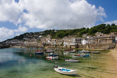 MOUSEHOLE, CORNWALL, UK - JUNE 27, 2016. The Cornish fishing village of Mousehole with its stone harbour and fishermen's cottages is a popular tourist destination in Cornwall, UK.のeditorial素材