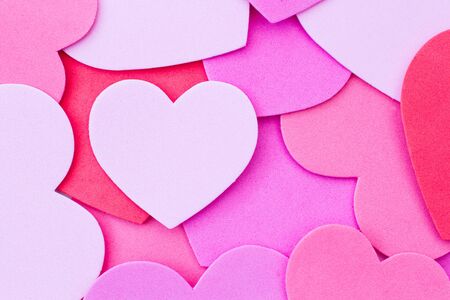 A Valentine's Day background of red and pink love hearts or heart shapes with copy spaceの写真素材