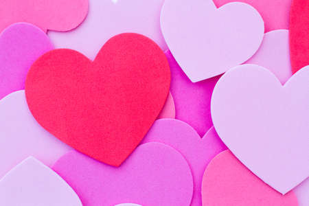 A Valentine's Day background of red and pink love hearts or heart shapes with copy spaceの写真素材