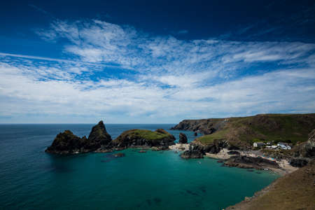 The picturesque and popular tourist destination of Kynance Cove in Cornwall showing the beautiful...