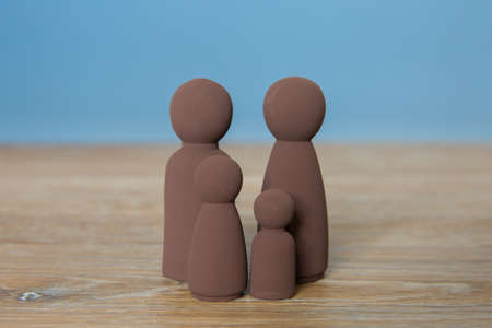 A family concept of a black or family of colour with mum, dad and two children with copy spaceの写真素材