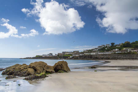 COVERACK, CORNWALL, UK - JULY 2, 2016.  A view of the headland and Dollar Point from the beach of the picturesque village of Coverack in Cornwall, UKのeditorial素材