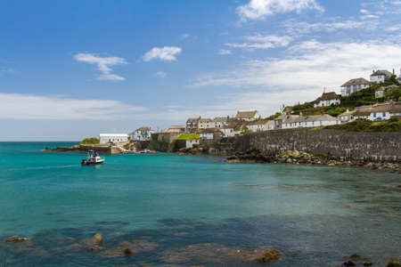 COVERACK, CORNWALL, UK - JULY 2, 2016.  A view of the headland and Dollar Point from the beach of the picturesque village of Coverack in Cornwall, UKのeditorial素材