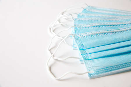 An example of blue surgical face mask used to protect the public from infectious diseases such as Coronavirus with copy spaceの写真素材