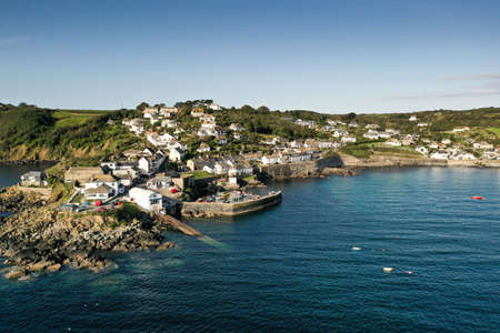 COVERACK, CORNWALL, UK - SEPTEMBER 10, 2020. An aerial landscape  image by drone of the picturesque Cornish fishing village and harbour of Coverack in Cornwall, UKのeditorial素材