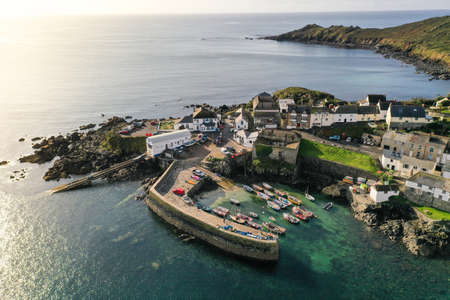 COVERACK, CORNWALL, UK - SEPTEMBER 12, 2020. An aerial landscape  image by drone of the picturesque Cornish fishing village and harbour of Coverack in Cornwall, UKのeditorial素材